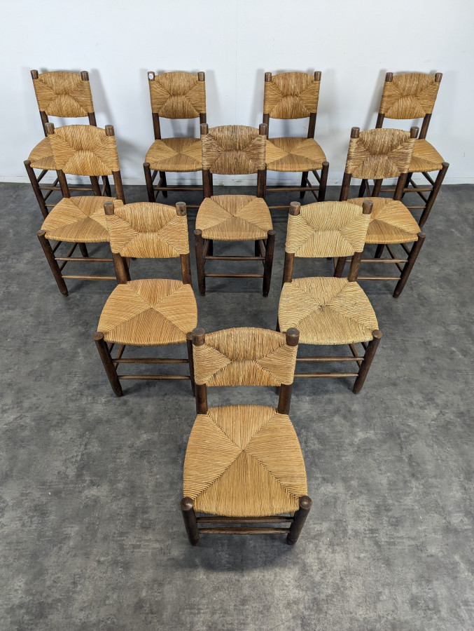 Série de 10 chaises modèle Bauche par Charlotte Perriand, circa 1960