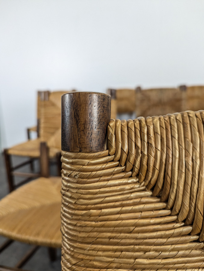 Série de 10 chaises modèle Bauche par Charlotte Perriand, circa 1960