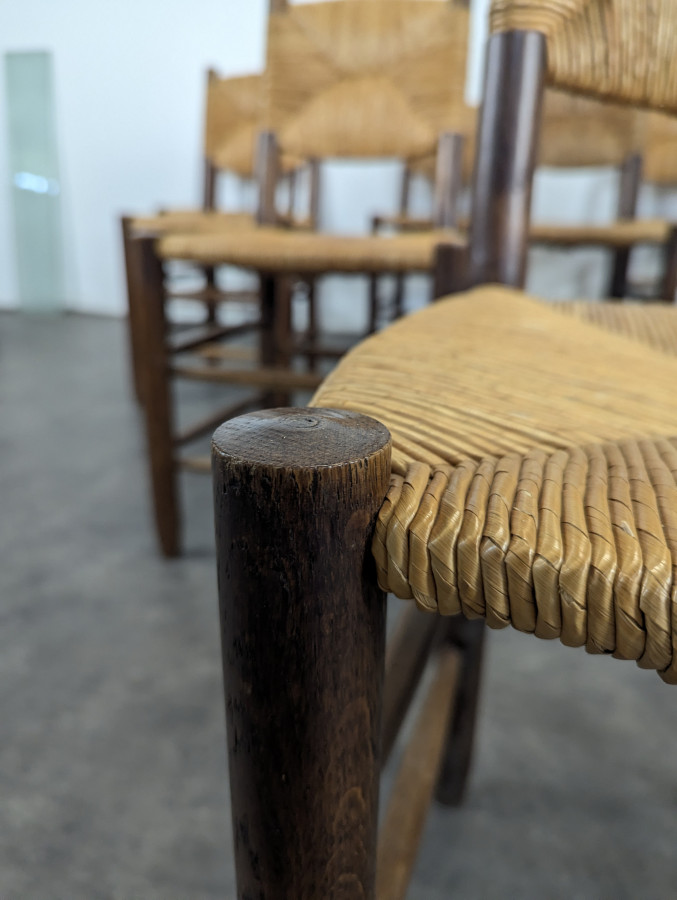 Série de 10 chaises modèle Bauche par Charlotte Perriand, circa 1960