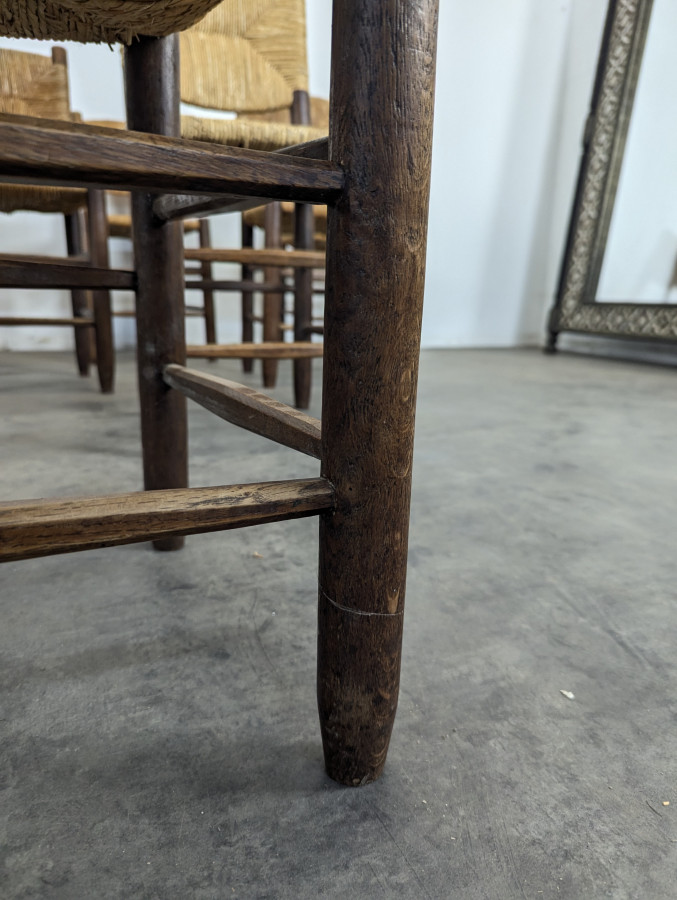Série de 10 chaises modèle Bauche par Charlotte Perriand, circa 1960