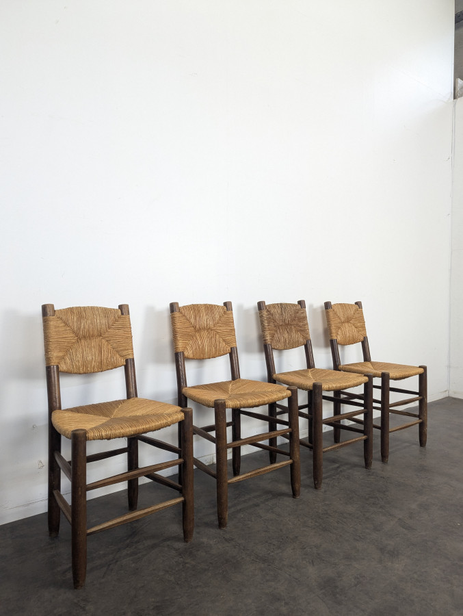 Série de 10 chaises modèle Bauche par Charlotte Perriand, circa 1960