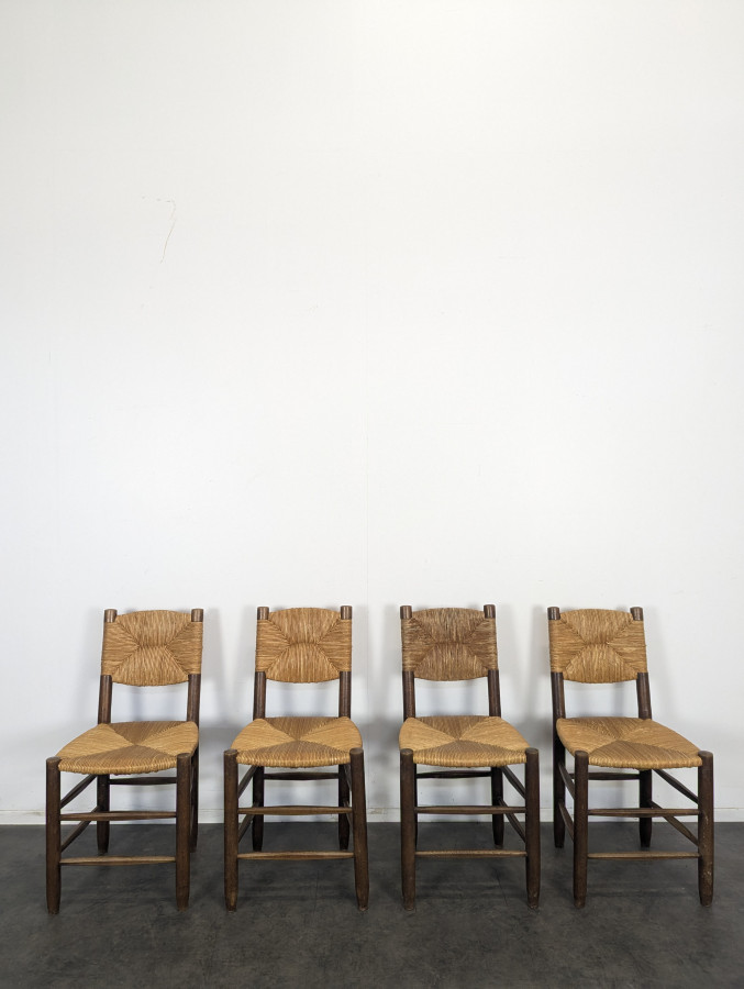 Série de 10 chaises modèle Bauche par Charlotte Perriand, circa 1960
