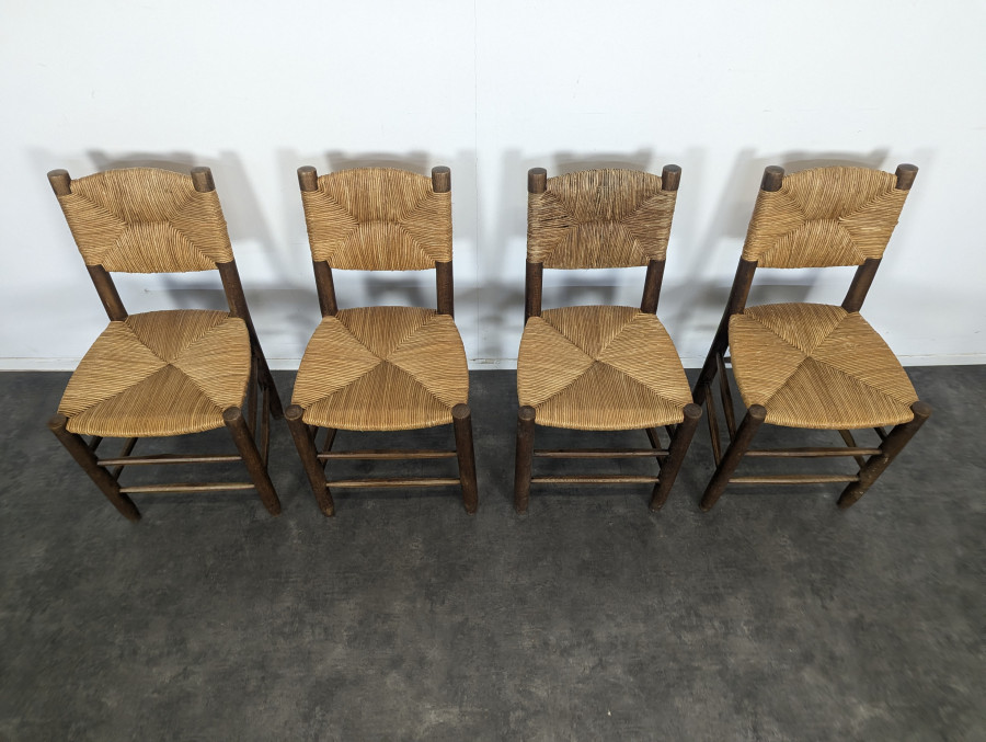 Série de 10 chaises modèle Bauche par Charlotte Perriand, circa 1960
