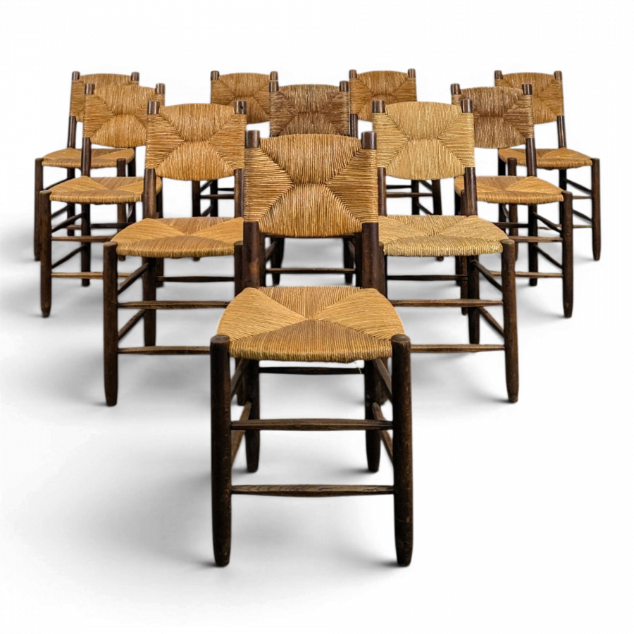 Série de 10 chaises modèle Bauche par Charlotte Perriand, circa 1960