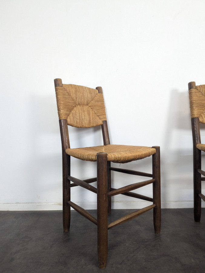 Série de 10 chaises modèle Bauche par Charlotte Perriand, circa 1960