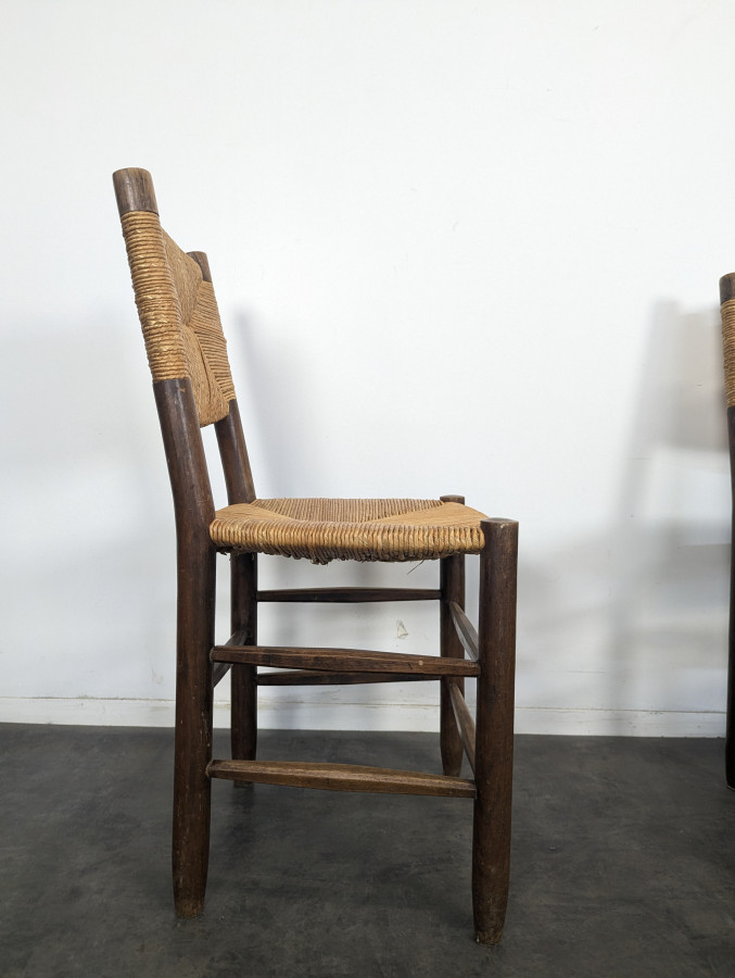Série de 10 chaises modèle Bauche par Charlotte Perriand, circa 1960
