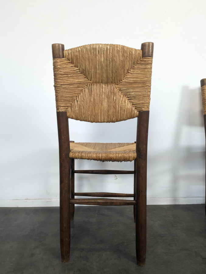 Série de 10 chaises modèle Bauche par Charlotte Perriand, circa 1960