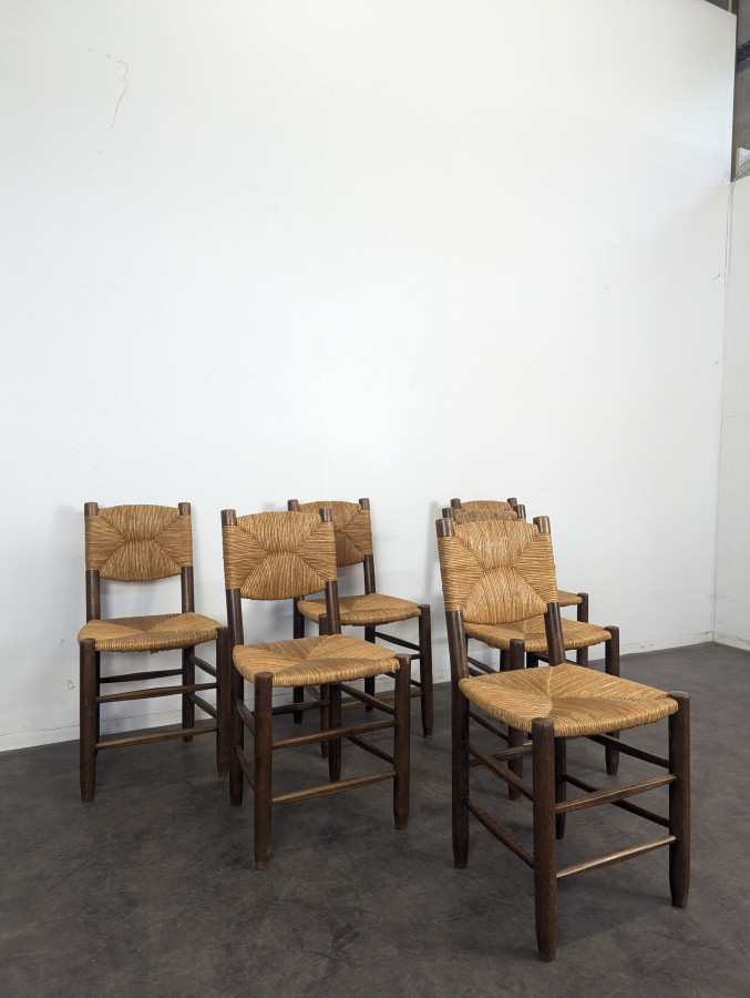 Série de 10 chaises modèle Bauche par Charlotte Perriand, circa 1960