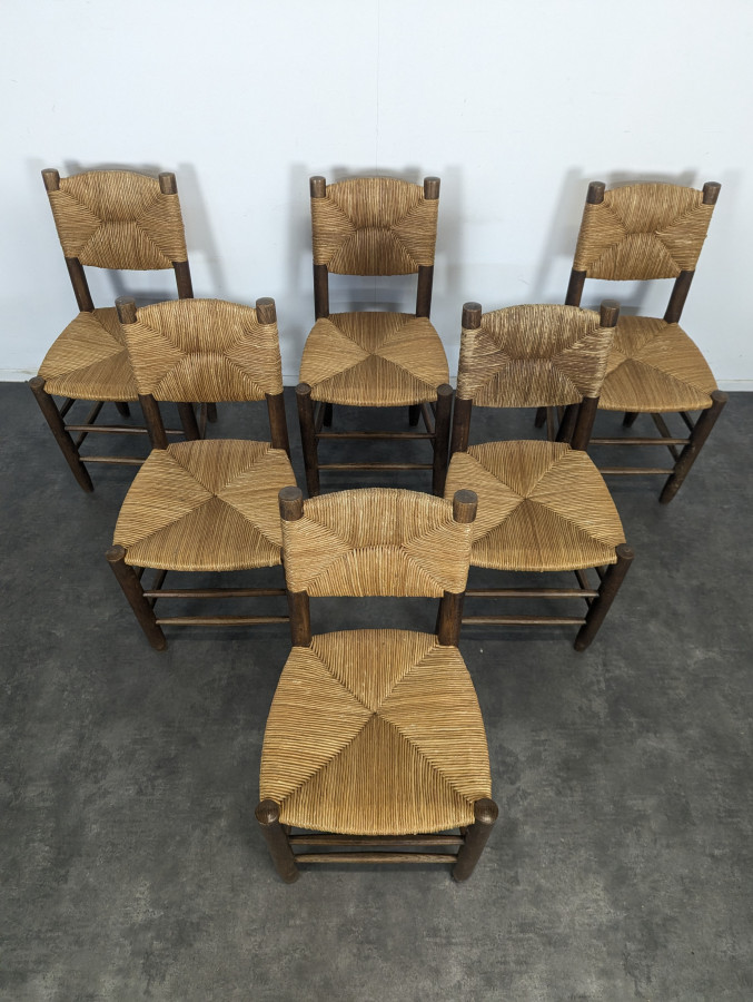 Série de 10 chaises modèle Bauche par Charlotte Perriand, circa 1960