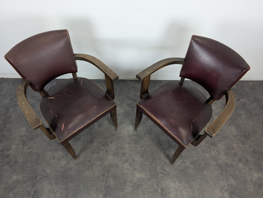 Paire de fauteuils bridge années 40 en chêne et skaï bordeaux