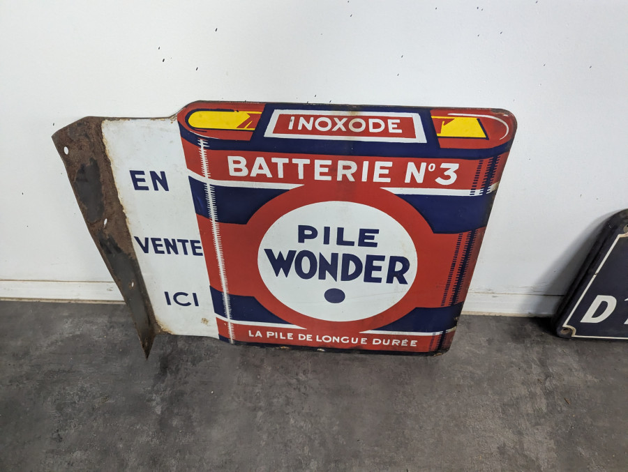 Plaque émaillée Pile Wonder double face à potence