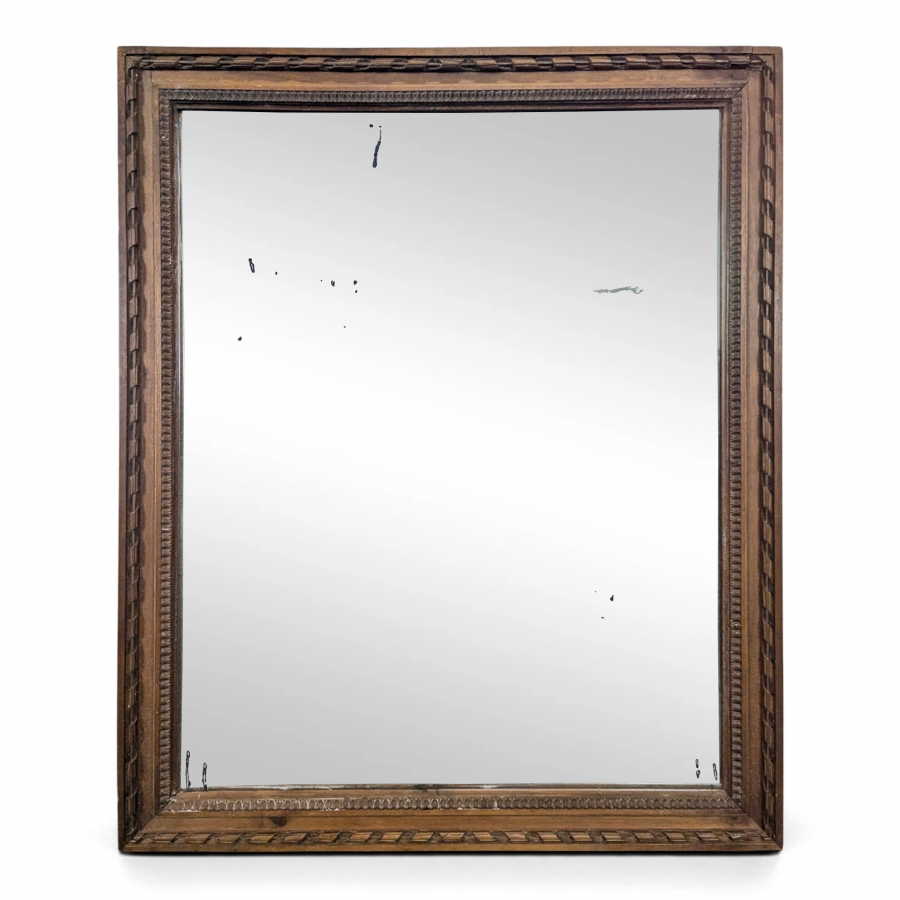 Miroir Napoléon III à cadre en bois sculpté et doré