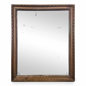 Miroir Napoléon III à cadre en bois sculpté et doré