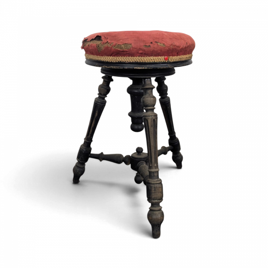 Tabouret de piano en velours rouge à fût tourné