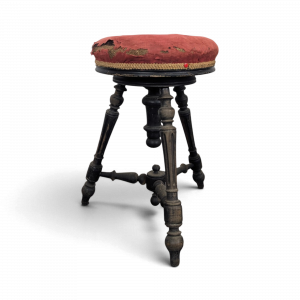 Tabouret de piano en velours rouge à fût tourné