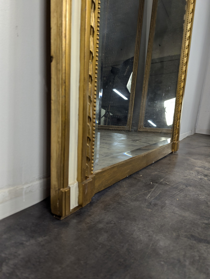 Miroir Trumeau de style Louis XVI à glace biseautée
