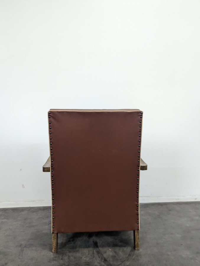 Fauteuil en skaï vintage années 50