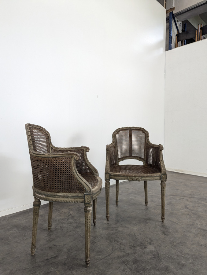 Paire de fauteuil cannés réchampi de style Louis XVI