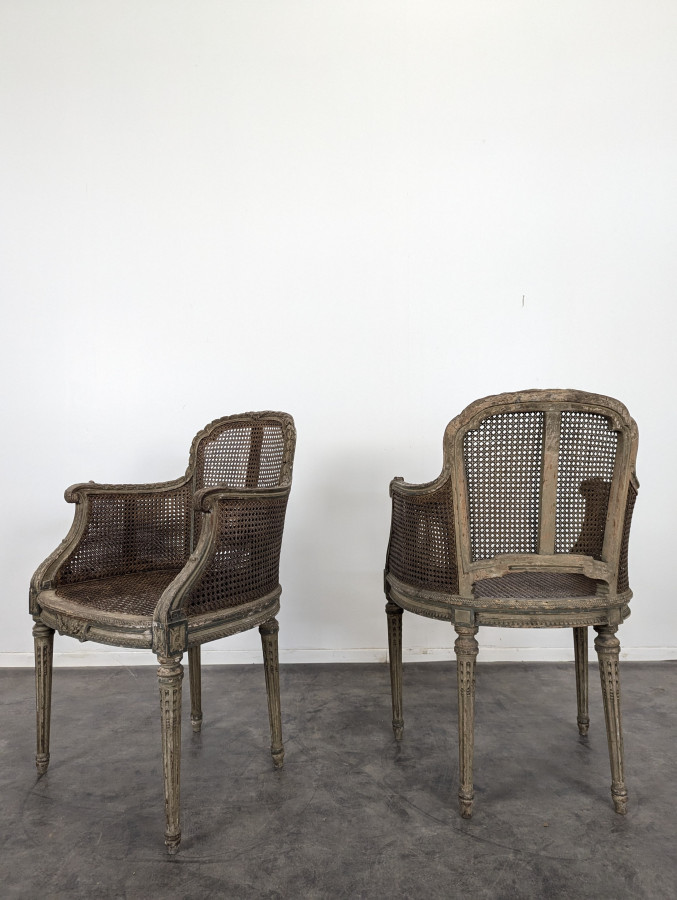Paire de fauteuil cannés réchampi de style Louis XVI