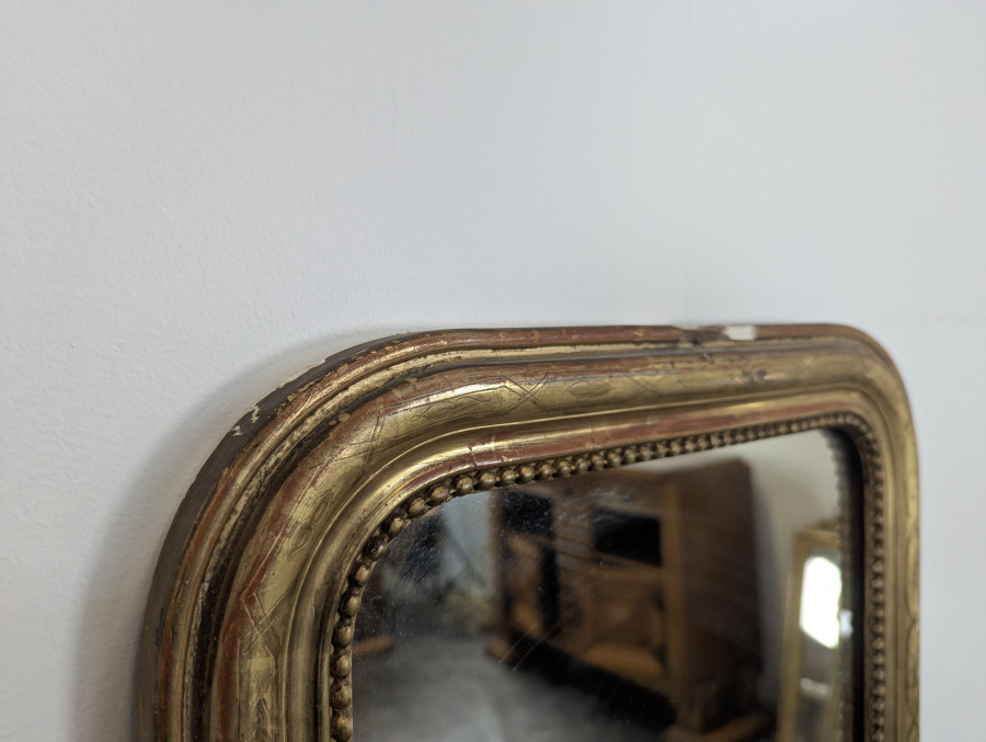 Miroir d'entre-deux en bois doré d'époque Louis Philippe