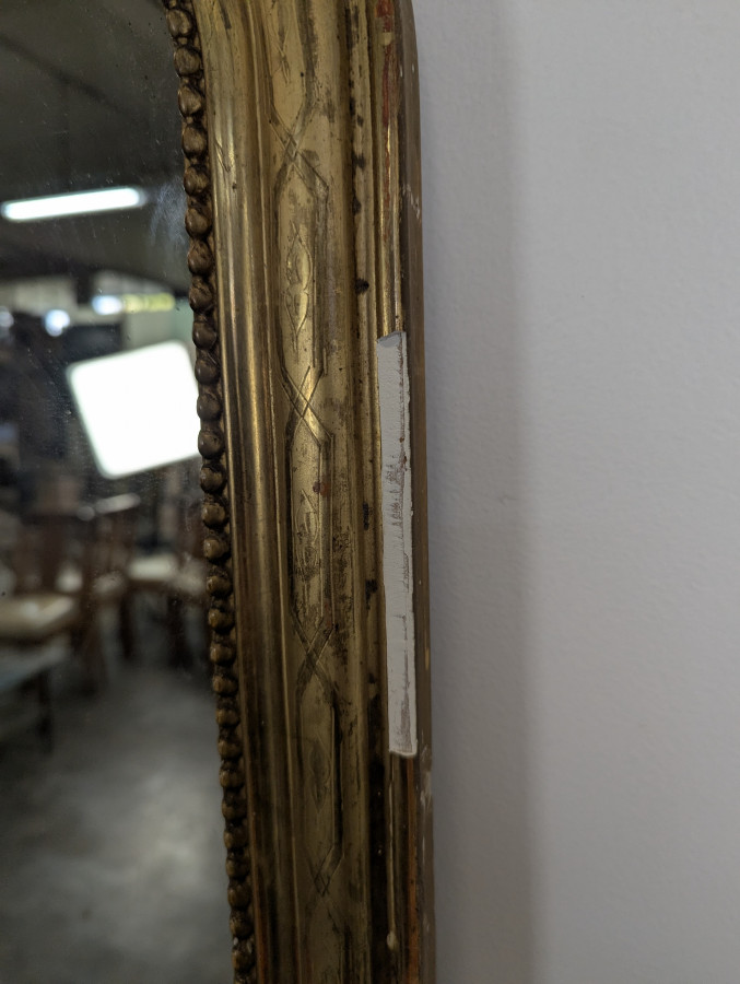 Miroir d'entre-deux en bois doré d'époque Louis Philippe