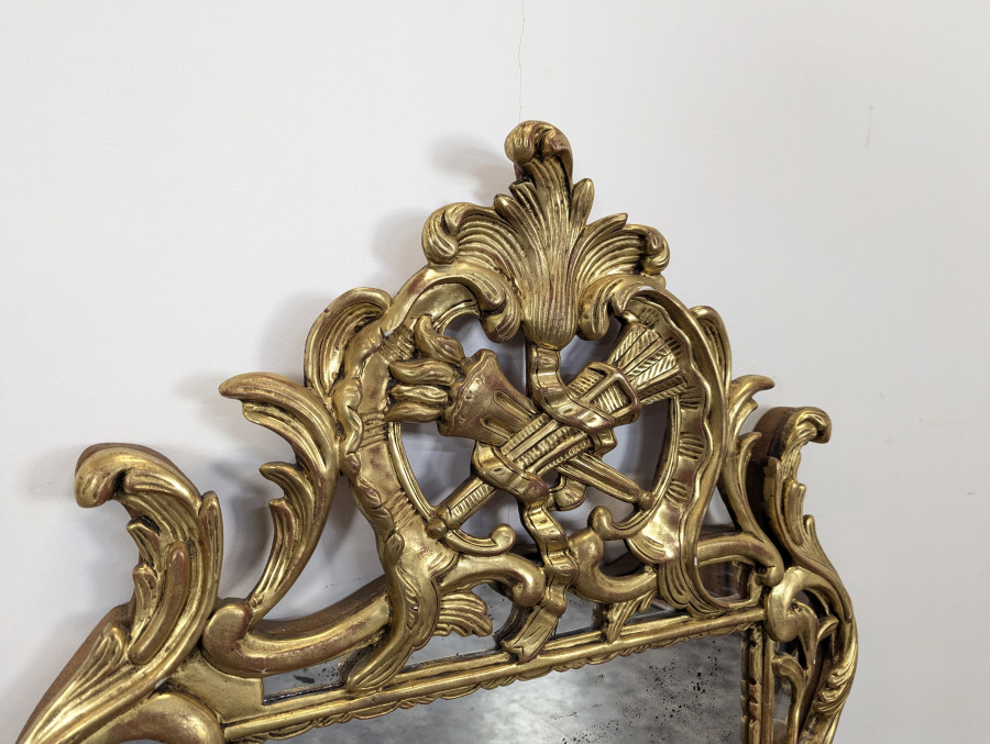 Miroir en bois doré à pareclose de style régence fin XIXeme