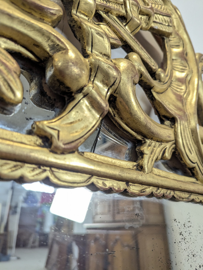 Miroir en bois doré à pareclose de style régence fin XIXeme