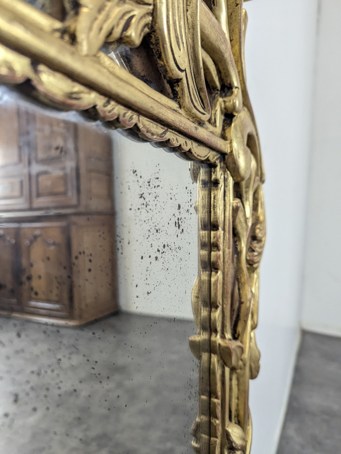 Miroir en bois doré à pareclose de style régence fin XIXeme