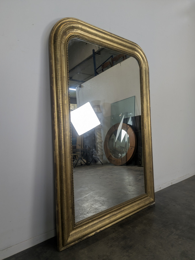 Miroir en bois doré à frise antique époque Louis Philippe