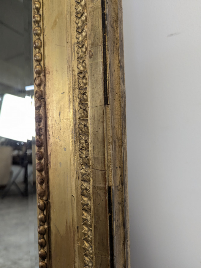 Grand miroir en bois doré de style Louis XVI fin XIXème