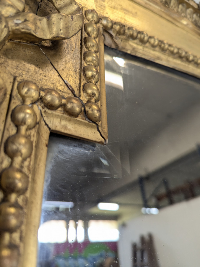 Grand miroir en bois doré de style Louis XVI fin XIXème