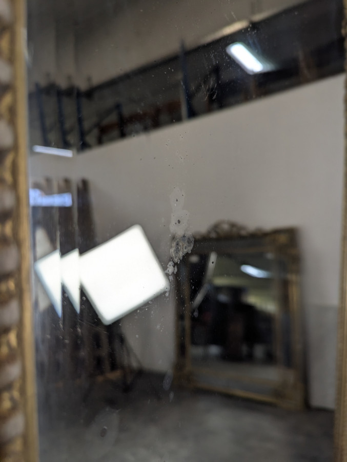 Grand miroir en bois doré de style Louis XVI fin XIXème