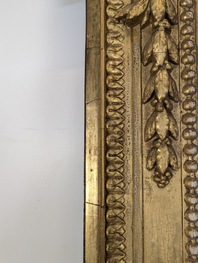 Grand miroir en bois doré de style Louis XVI fin XIXème