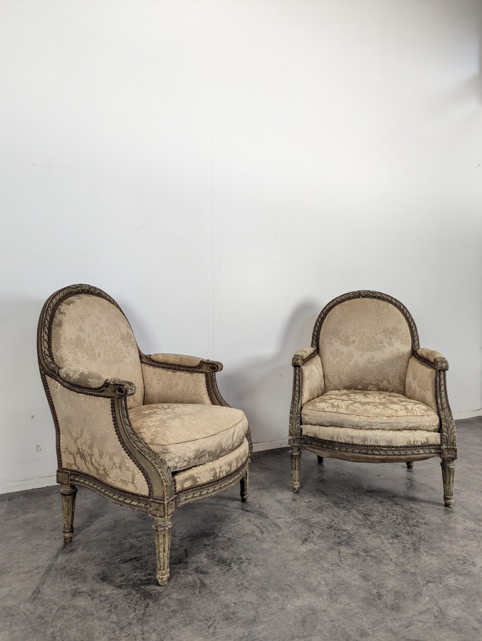 Paire de Bergères réchampies de style Louis XVI
