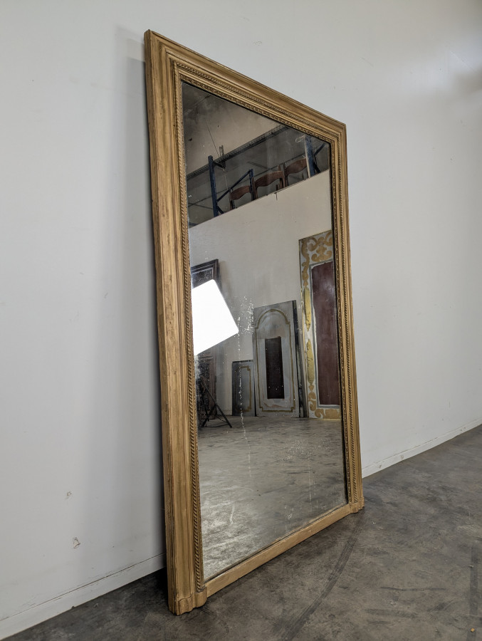 Grand miroir en bois et stuc doré époque Louis Philippe